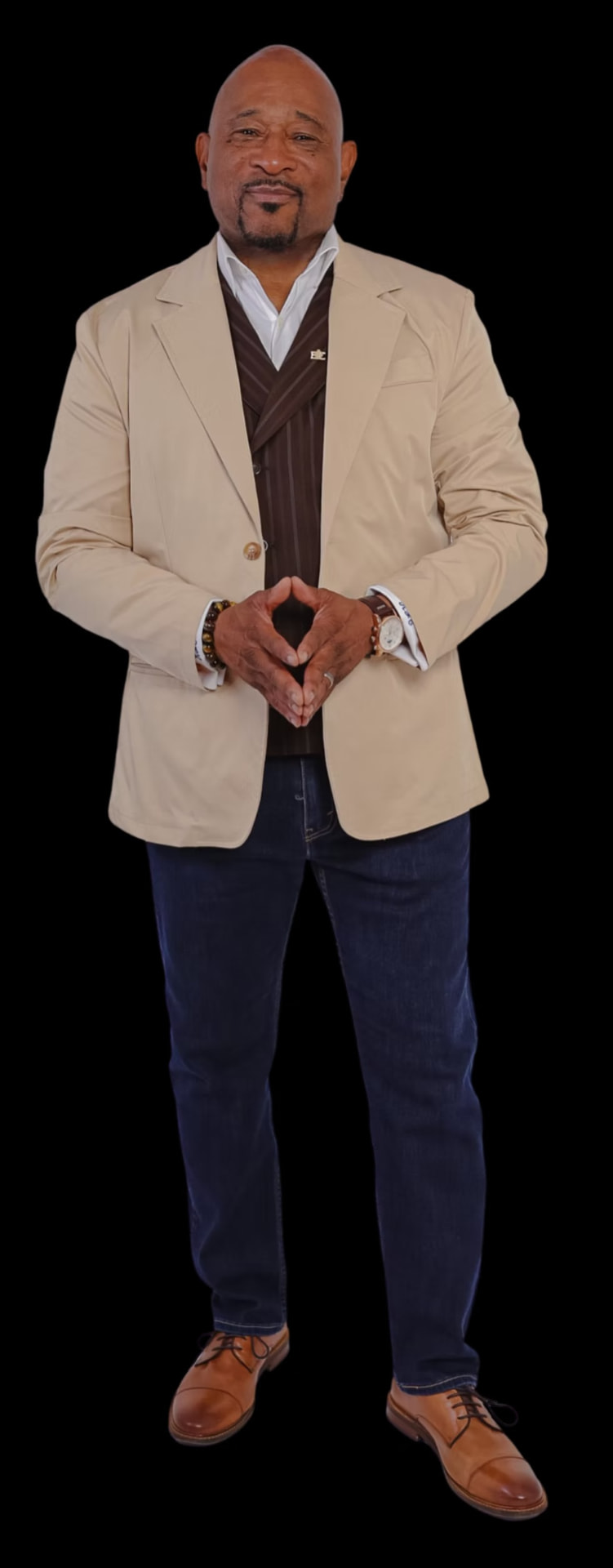Full-length portrait of Coach C in a tailored jacket