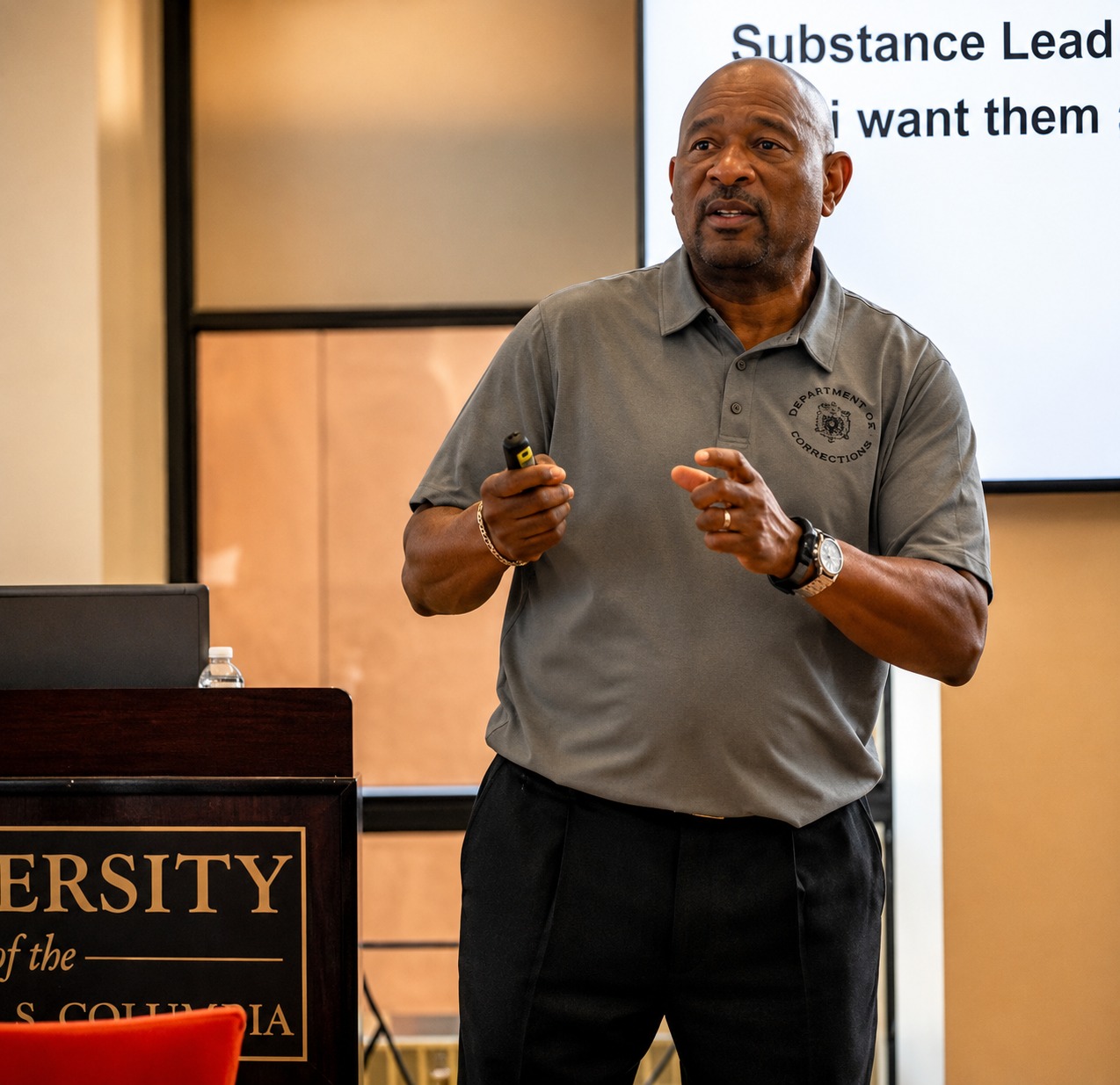 Coach C mid-presentation, speaking on substance-based leadership
